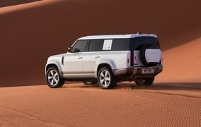 SUV Land Rover Defender 130 in the desert