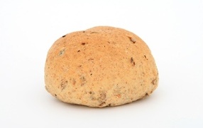 Loaf of round bread on white background