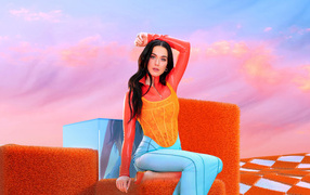 American singer Katy Perry sits on a cube