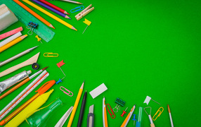 Green background with stationery items