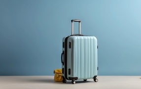 Large blue suitcase on a blue background