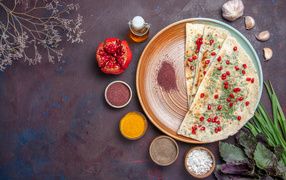 Flatbread on the table with spices and herbs