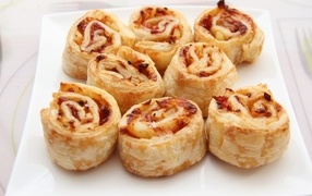 Baked rolls with filling on the table