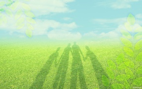 Shadow of family on the grass