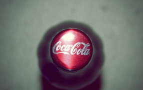 Cover the bottle with Coca-Cola