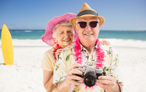 Mature man and woman relaxing on the beach