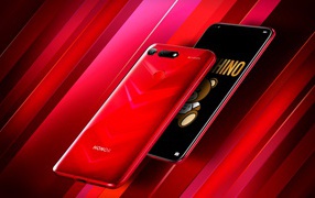 Stylish slim smartphone Honor View 20 on a red background