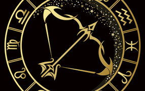 Golden zodiac sign Sagittarius on a black background