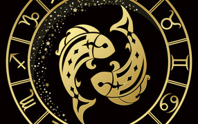 Golden zodiac sign of fish on a black background