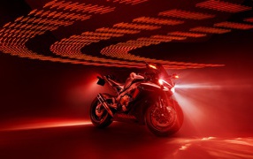 Honda Fireblade motorcycle on a red background