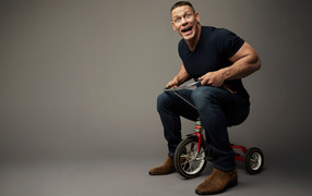 American wrestler John Cena on a children's bike