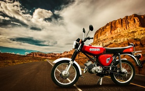 Red simson s50cc motorcycle at the mountains