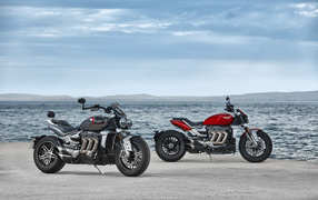 Two 2021 Triumph Rocket 3 motorcycles on the shore