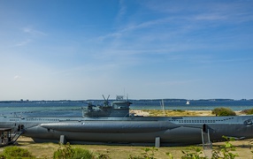 Large submarine on the shores of the Baltic Sea