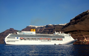 Large white cruise ship off the coast of Santorini, Greece