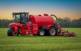 Big red combine on the field