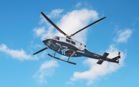Police helicopter in blue sky
