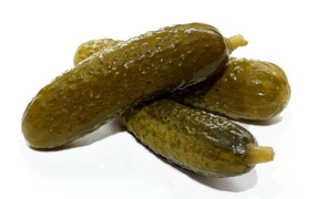 Pickled gherkins on a white background