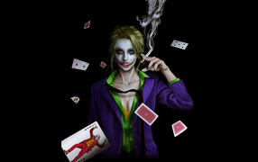 Joker girl with cards on a black background