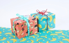 Two bright multi-colored boxes with gifts