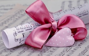 Notes with a bow and a red heart for your beloved