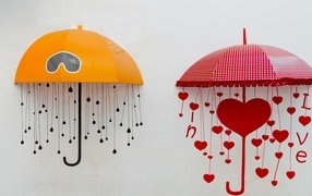 Two drawn umbrellas on a gray surface