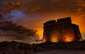 Old fortress in the light of lanterns at night