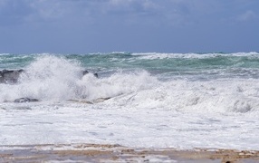 White sea foam on the seashore