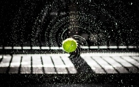 Tennis ball in splashing water
