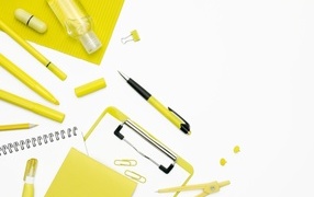Yellow stationery items on a white background