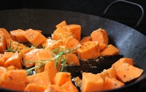 Carrots in a pan with rosemary