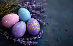 Beautiful Easter eggs with willow branches on a gray table