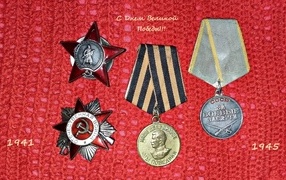 Medals on a red background for Victory Day on May 9