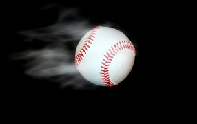 Baseball ball flies on a black background
