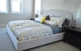 Large soft bed in a gray bedroom