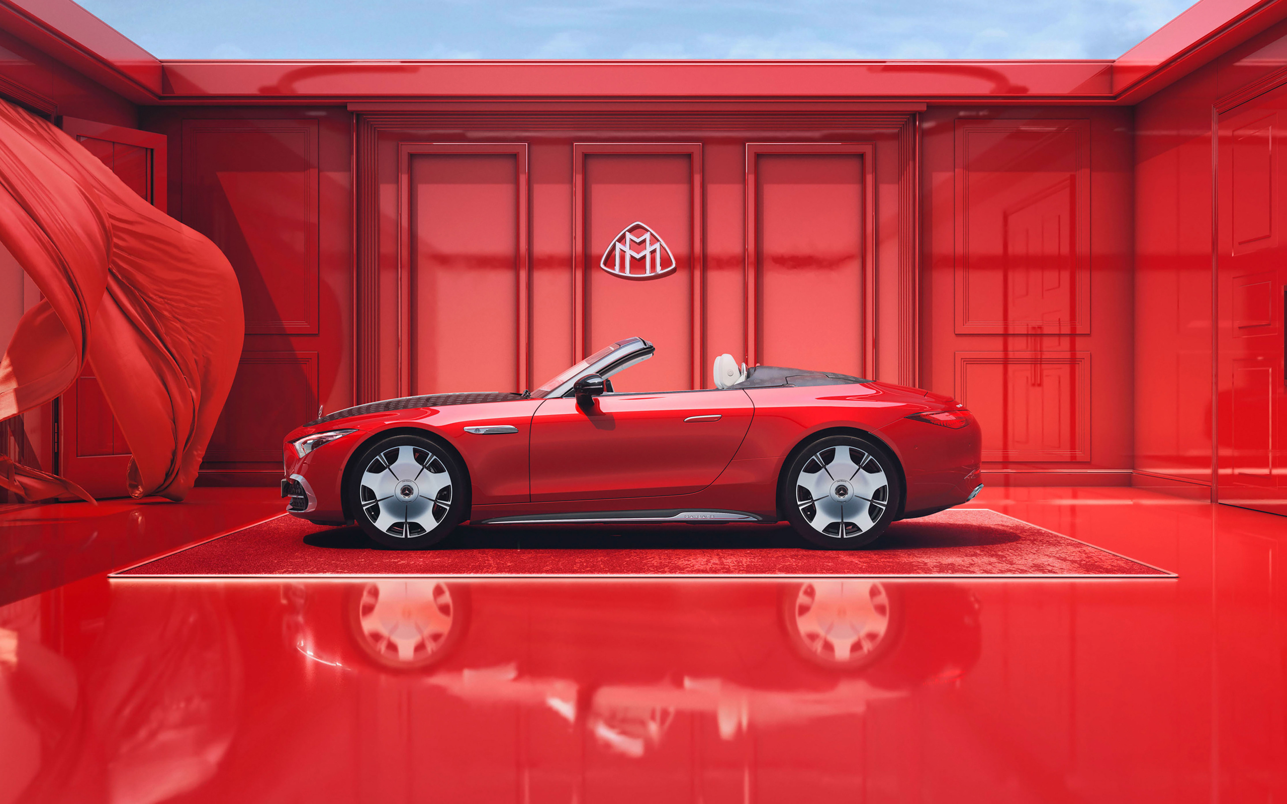 Вид сбоку на красный автомобиль Mercedes-Maybach SL 680 Monogram Series 2024 года